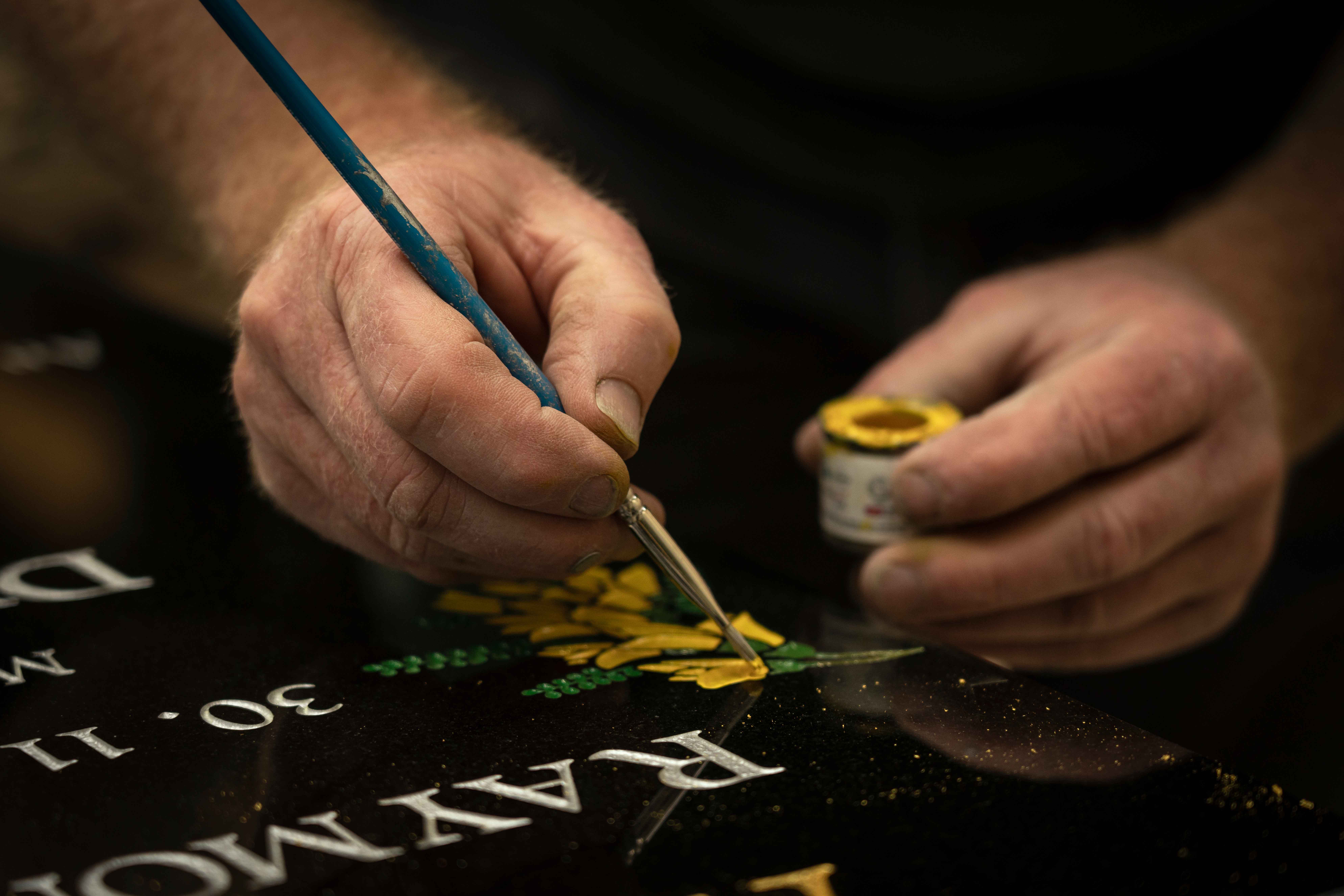 Robinson Memorial Stone Mason crafting a headstone